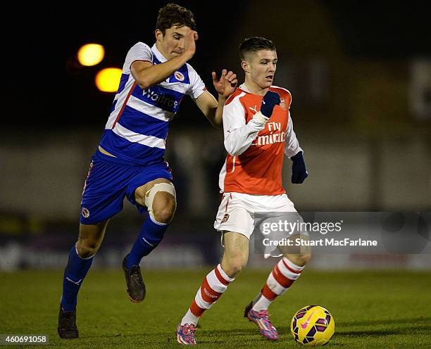 Dan Crowley of Arsenal breaks past Andrija Novakouich of Reading during the FA Youth Cup 3rd Round match between Arsenal and Reading at Meadow Park...