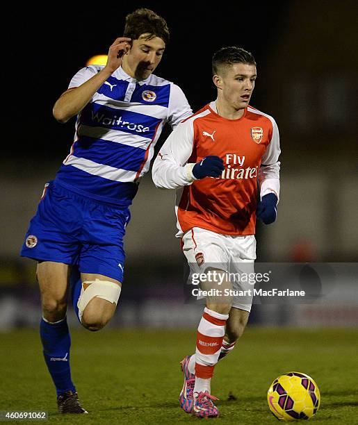 Dan Crowley of Arsenal breaks past Andrija Novakouich of Reading during the FA Youth Cup 3rd Round match between Arsenal and Reading at Meadow Park...