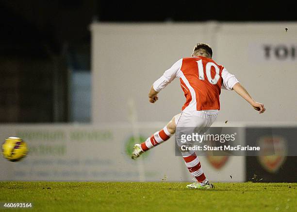 Dan Crowley shoots past Reading goalkeeper Lewis Ward to socre Arsenal's goal from the penalty spotduring the FA Youth Cup 3rd Round match between...