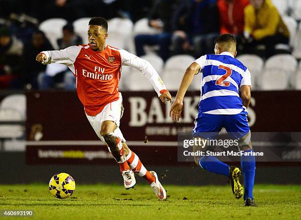 Chris Willock of Arsenal breaks past Tennai Watson of Reading during the FA Youth Cup 3rd Round match between Arsenal and Reading at Meadow Park on...