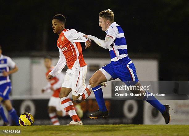 Chris Willock of Arsenal breaks past Jake Sheppard of Reading during the FA Youth Cup 3rd Round match between Arsenal and Reading at Meadow Park on...