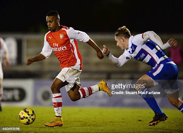 Tyrell Robinson of Arsenal breaks past Jake Sheppard of Reading during the FA Youth Cup 3rd Round match between Arsenal and Reading at Meadow Park on...