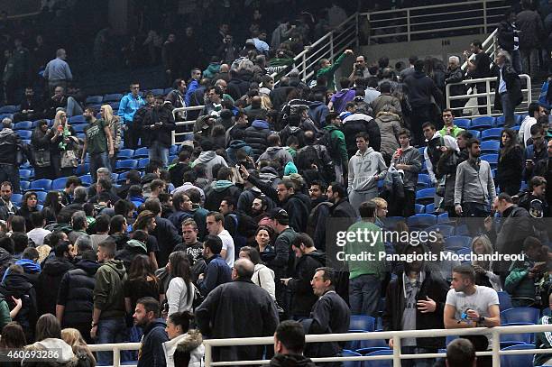 People are urgently evacuated from the stadium following a bomb threat made during the 2014-2015 Turkish Airlines Euroleague Basketball Regular...