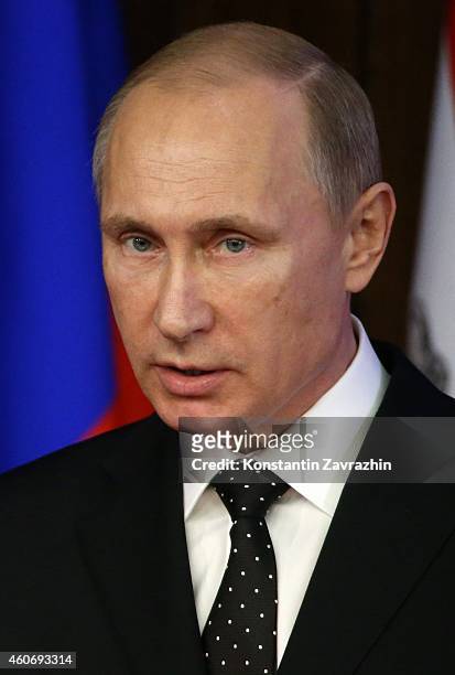 Russian President Vladimir Putin delivers a speech during a visit to the Defence Ministry's newly built control room on December 2014 in Moscow,...