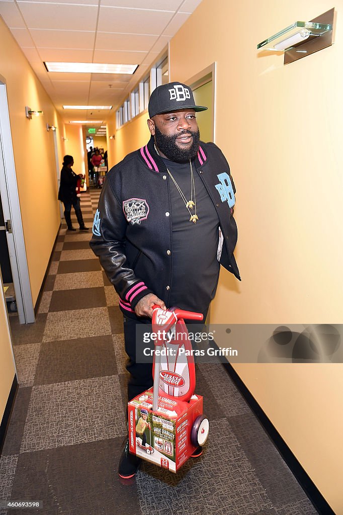 Rick Ross Surprises Atlanta Families With Holiday Gifts