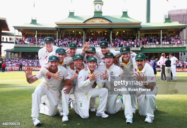 The Australian Cricket Team celebrate with the urn during day three of the Fifth Ashes Test match between Australia and England at Sydney Cricket...