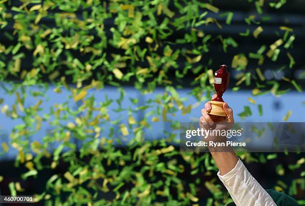 Michael Clarke of Australia lifts the urn during day three of the Fifth Ashes Test match between Australia and England at Sydney Cricket Ground on...