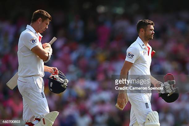 Boyd Rankin and James Anderson of England walk off the field after losing the match during day three of the Fifth Ashes Test match between Australia...