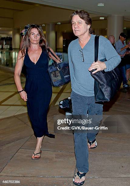 Eddie Van Halen and Janie Liszewski are seen at Los Angeles International Airport on June 27, 2012 in Los Angeles, California.