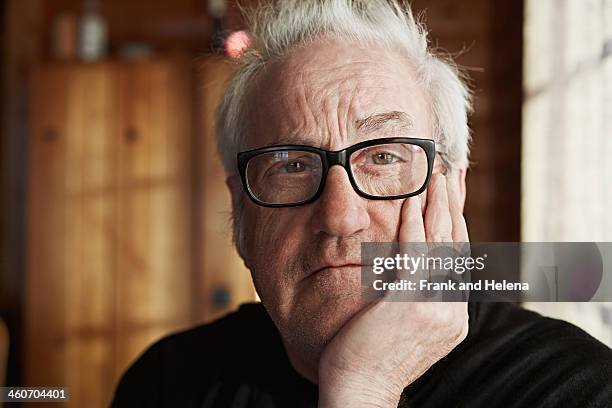 senior man with grey hair and glasses - weisheit stock-fotos und bilder