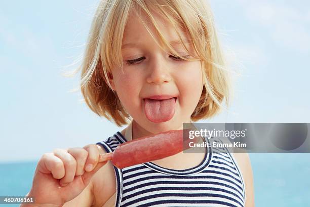 child about to lick ice lolly - girls licking girls stock pictures, royalty-free photos & images