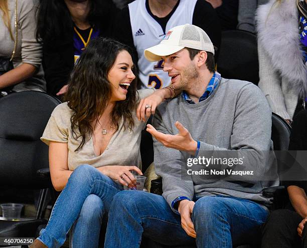 Mila Kunis and Ashton Kutcher attend a basketball game between the Oklahoma City Thunder and the Los Angeles Lakers at Staples Center on December 19,...