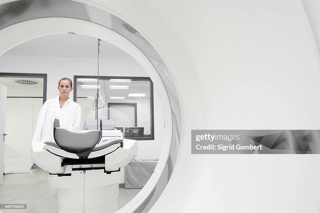 Portrait of female doctor through ct scanner
