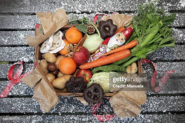 unwrapped box of savoury and sweet christmas food - winter vegetables foto e immagini stock