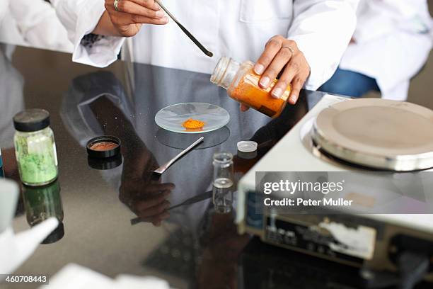 female technician weighing chemicals in laboratory - laboratory scale stock pictures, royalty-free photos & images