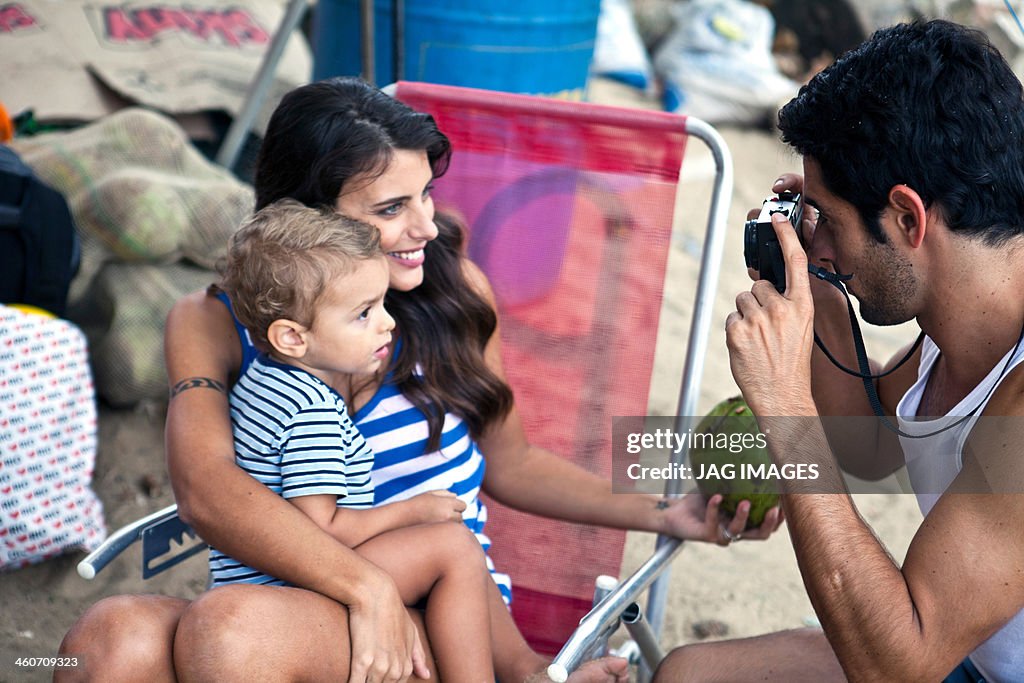 Mother and son, father taking photograph