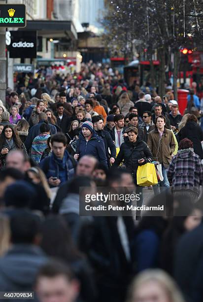 Shoppers crowd the pavement in Oxford Street on December 20, 2014 in London, England. Shoppers in the United Kingdom are expected to spend £1.2...