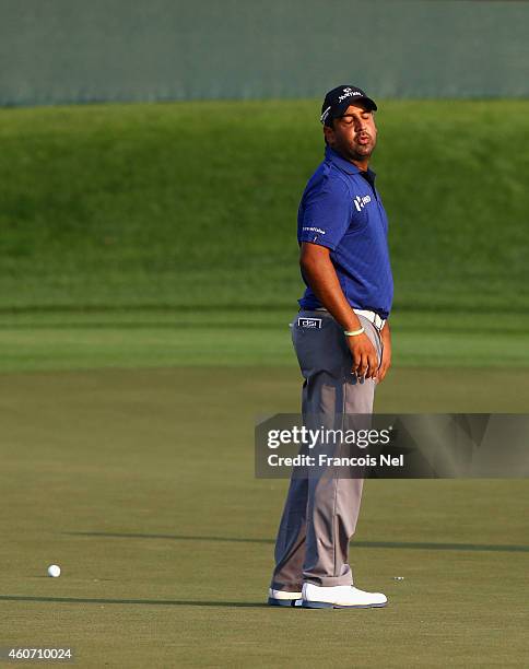 Shiv Kapur of India reacts after missing a putt on the 18th hole during the third round of the Dubai Open at The Els Club Dubai on December 20, 2014...