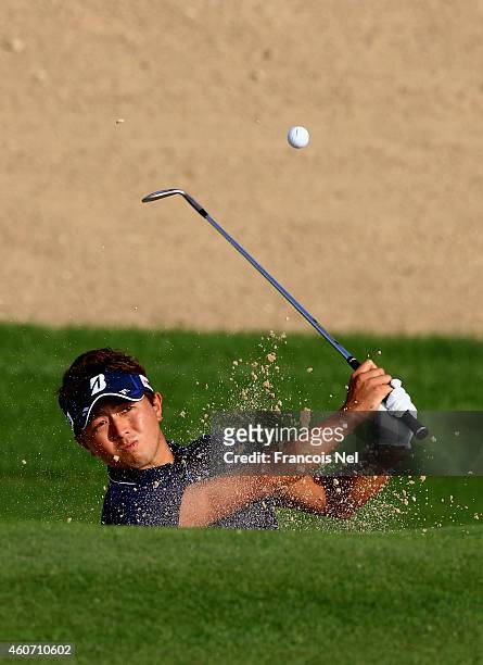 Daisuke Kataoka of Japan in action during the third round of the Dubai Open at The Els Club Dubai on December 20, 2014 in Dubai, United Arab Emirates.