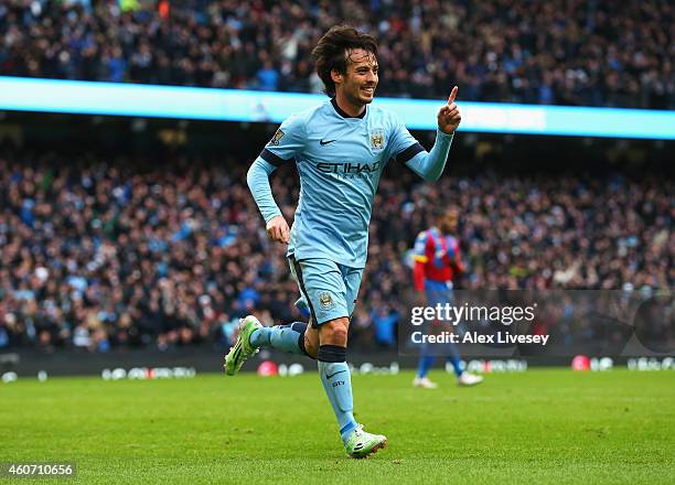 David Silva of Manchester City celebrates scoring his team's second goal during the Barclays Premier League match between Manchester City and Crystal...