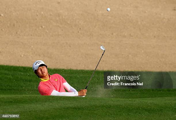 Jeung-hun Wang of Korea in action during the third round of the Dubai Open at The Els Club Dubai on December 20, 2014 in Dubai, United Arab Emirates.