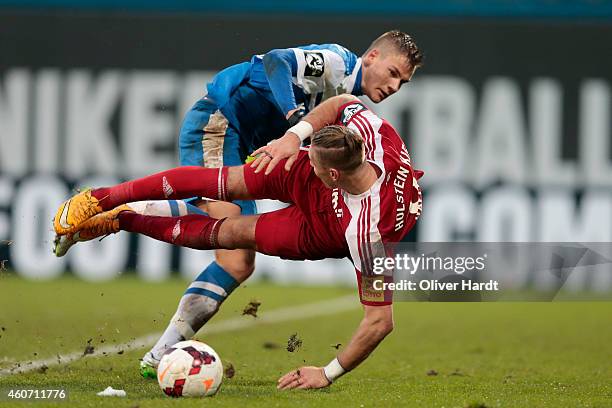 Max Christiansen of Rostock and Manuel Schaeffler of Kiel compete during the Third League match between Hansa Rostock and Holstein Kiel at DKB-Arena...