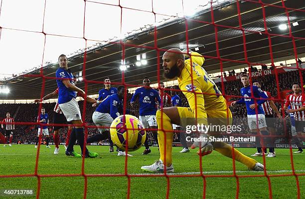 Romelu Lukaku of Everton scores an own goal past Tim Howard of Everton during the Barclays Premier League match between Southampton and Everton at St...