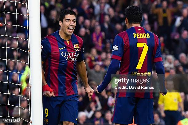 Luis Suarez of FC Barcelona celebrates with his teammate Pedro Rodriguez of FC Barcelona after scoring his team's second goalduring the La Liga match...
