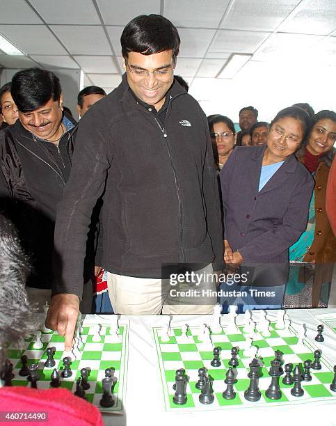 Five-time World Champion and NIIT Mind Champions Viswanathan Anand playing chess with school kids during a school funcion at St Rafaels School, on...