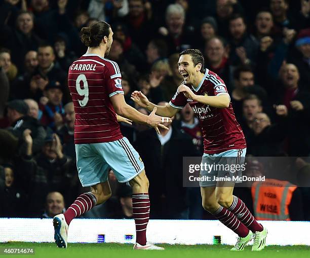 Stewart Downing of West Ham celebrates with Andy Carroll of West Ham after scoring their second goal during the Barclays Premier League match between...