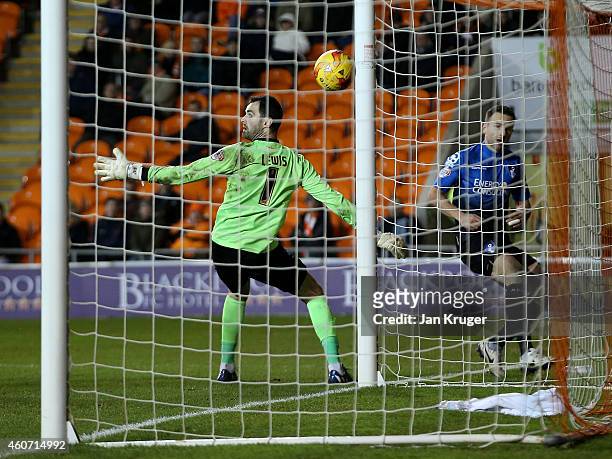 Marc Pugh of AFC Bournemouth steers the ball past Joe Lewis, Goalkeeper of Blackpool for his goal during the Sky Bet Championship match between...