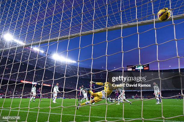 Lionel Messi of FC Barcelona scores his team's fourth goal during the La Liga match between FC Barcelona and Cordoba CF at Camp Nou on December 20,...