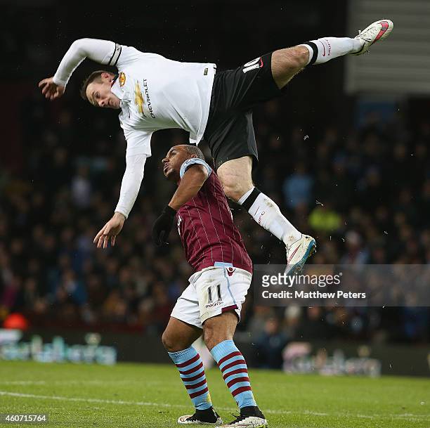 Wayne Rooney of Manchester United in action with Gabriel Agbonlahor of Aston Villa during the Barclays Premier League match between Aston Villa and...