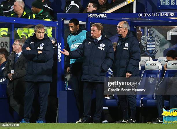 Harry Redknapp, manager of QPR looks on with Kevin Bond and Joe Jordan during the Barclays Premier League match between Queens Park Rangers and West...