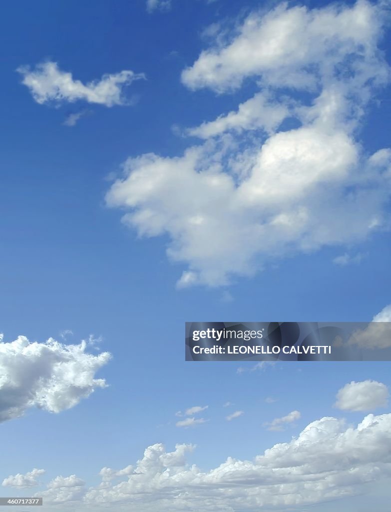 Blue sky with cumulus clouds, artwork