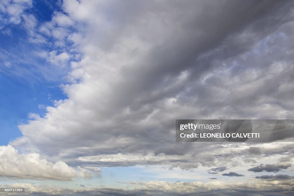 Blue sky with cumulus clouds, artwork