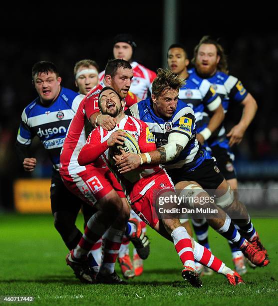 Greg Laidlaw of Gloucester is tackled by Dominic Day of Bath during the Aviva Premiership match between Gloucester Rugby and Bath Rugby at Kingsholm...