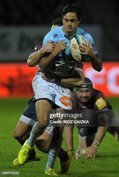 Bayonne's argentinian winger Martin Bustos Moyano is tackled by Bordeaux's French center Felix Le Bourhis during the French Top 14 rugby union match...