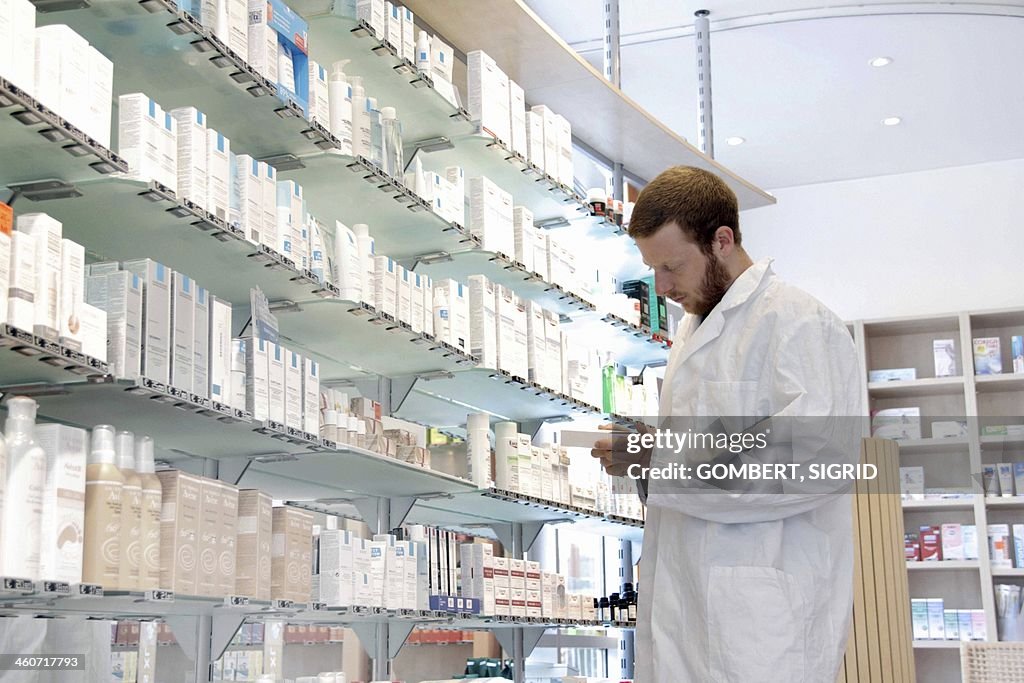 Pharmacist selecting drugs