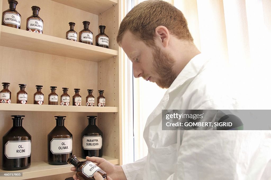 Pharmacist selecting drugs