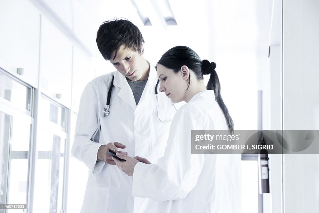 Doctors discussing notes