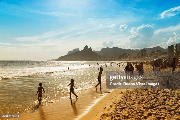 bathers on the beach of ipanema - ipanema beach stock pictures, royalty-free photos & images