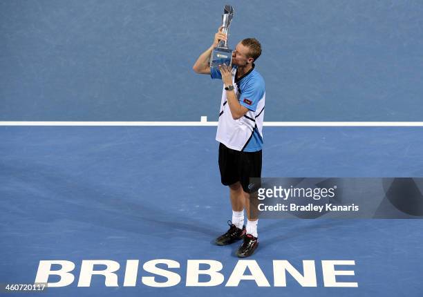 Lleyton Hewitt of Australia holds the winners trophy as he celebrates victory after the Mens finals match against Roger Federer of Switzerland during...