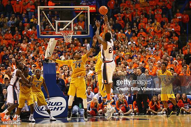 Rayvonte Rice of the Illinois Fighting Illini shoots the game-winning shot over Keith Shamburger of the Missouri Tigers during the 34th Annual Bud...