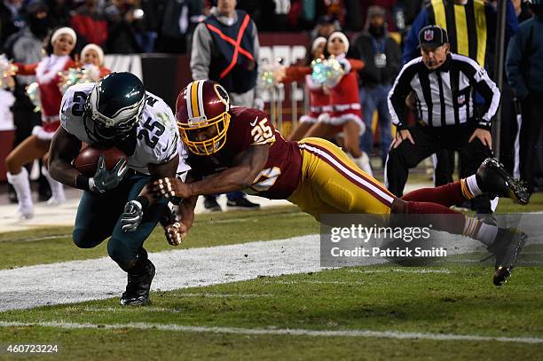 Running back LeSean McCoy of the Philadelphia Eagles scores a first quarter touchdown past the defense of free safety Ryan Clark of the Washington...