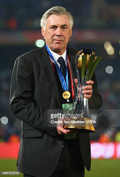 Head coach Carlo Ancelotti of Real Madrid celebrates with the trophy after the FIFA Club World Cup Final between Real Madrid and San Lorenzo at...