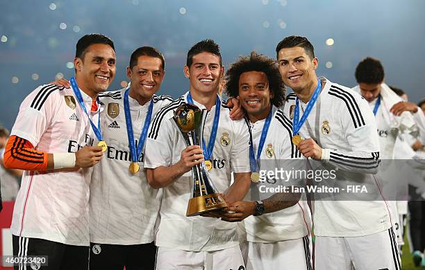 Real Madrid players celebrate with the trophy after the FIFA Club World Cup Final between Real Madrid and San Lorenzo at Marrakech Stadium on...