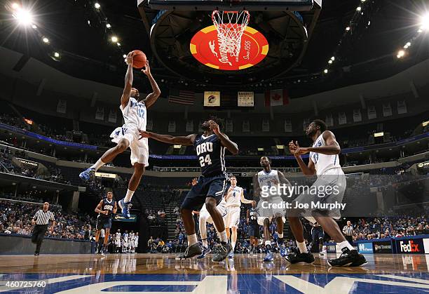 Marnier Cunningham of the Memphis Tigers drives to the basket for a layup against the Oral Roberts Golden Eagles on December 20, 2014 at FedExForum...