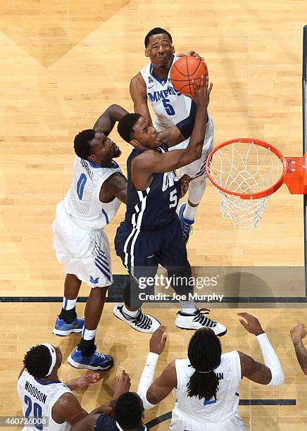 Nick King of the Memphis Tigers blocks a shot attempt by Brandon Conley of the Oral Roberts Golden Eagles on December 20, 2014 at FedExForum in...