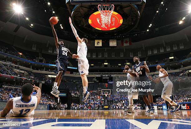 Korey Billbury of the Oral Roberts Golden Eagles shoots a layup against Austin Nichols of the Memphis Tigers on December 20, 2014 at FedExForum in...